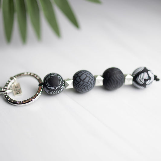 Black four-ball keychain